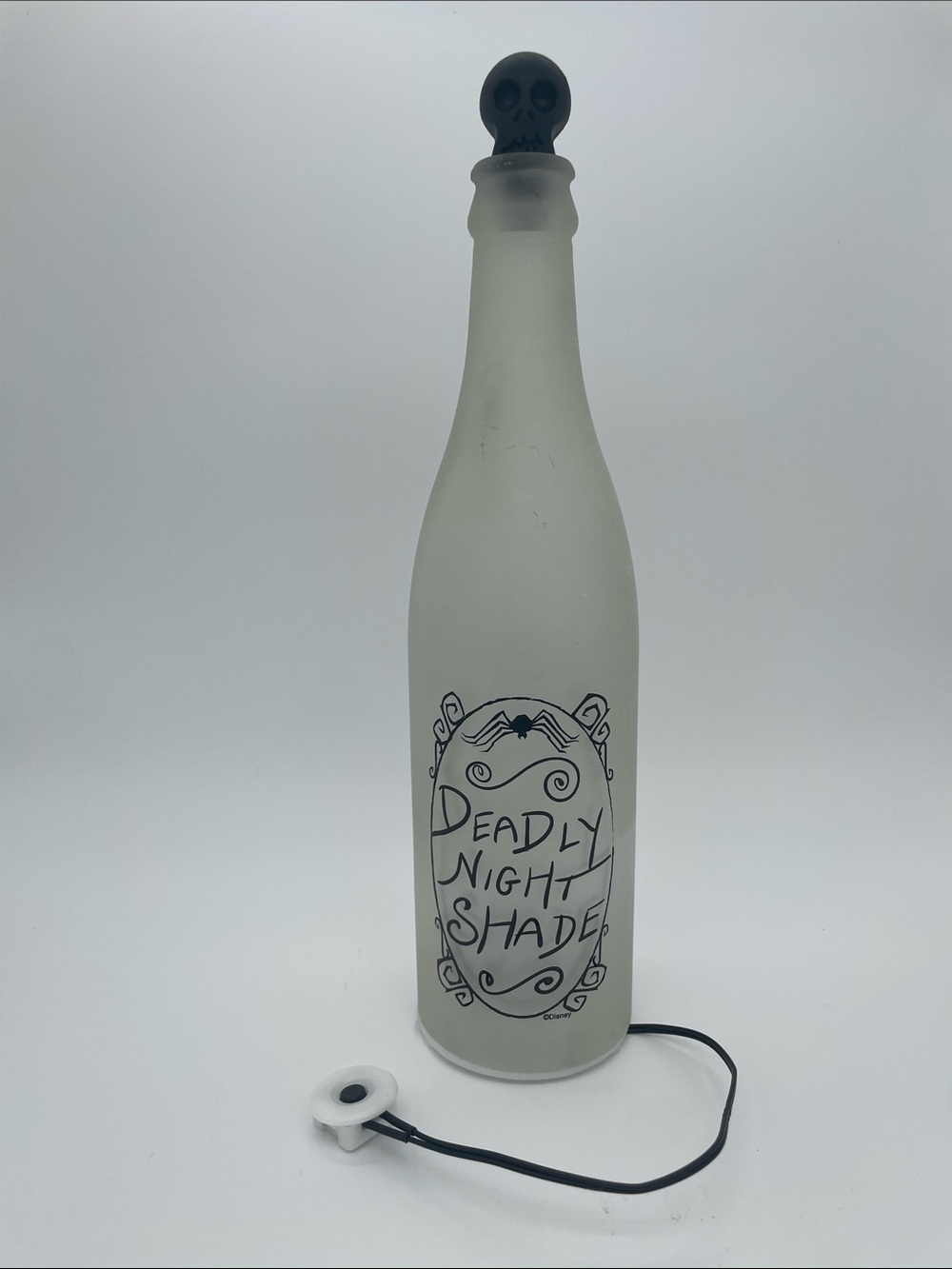 Disney Deadly Night Shade Frosted Bottle Lamp - purple lite up.